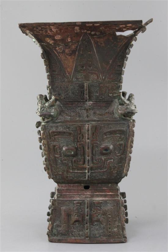 A rare Chinese archaic bronze ritual wine vessel, Fangzun, Shang dynasty, 13th-11th century B.C., 33.5cm high, losses and repairs